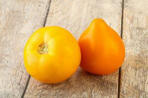 Ripe yellow bright juicy tomato photo