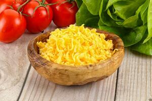 Shredded cheese in the bowl photo