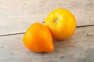 Ripe yellow bright juicy tomato photo