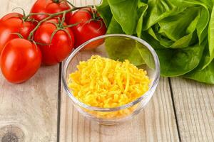 Shredded cheese in the bowl photo