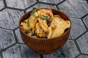 Thai red spicy curry with chicken photo