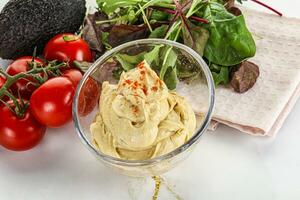 Creamy hummus in the bowl photo