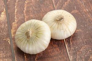 Raw white onion heap isolated photo