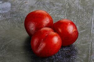 Ripe sweet juicy red plum photo