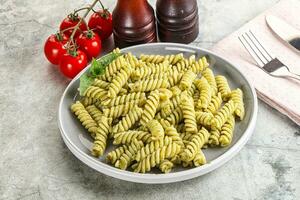 Italian pasta with basil pesto photo