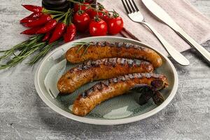 Grilled meat sausages with spices photo