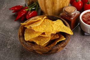 Mexican corn nachos chips with salsa photo