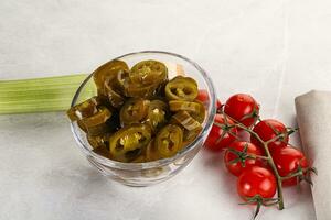 Sliced canned jalapeno pepper photo