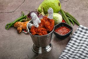 Indian cuisine glazed chicken lollipop photo