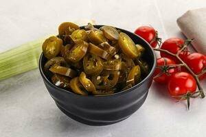 Sliced canned jalapeno pepper photo