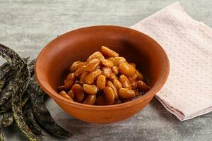 Canned white bean in tomato sauce photo