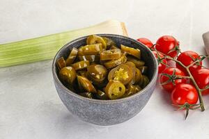 Sliced canned jalapeno pepper photo