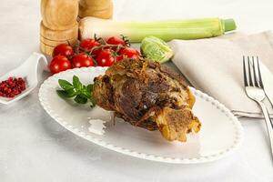 Baked Lamb shank with bone photo