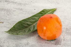 Fresh ripe sweet juicy persimmon photo