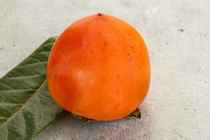 Fresh ripe sweet juicy persimmon photo