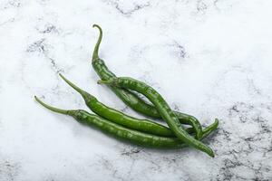 Hot and spicy green chili pepper photo