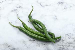 Hot and spicy green chili pepper photo