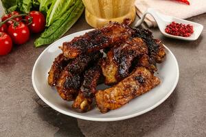 Grilled pork ribs in barbecue sauce photo