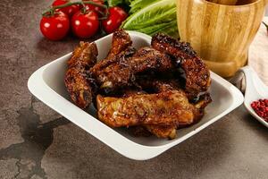 Grilled pork ribs in barbecue sauce photo