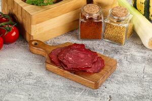 Smoked beef meat - Pastrami slices photo