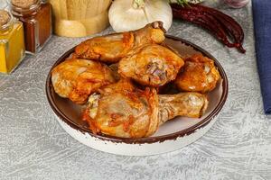 Raw marinated chicken drumstick for cooking photo