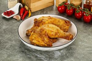 Roasted chicken leg with spices photo