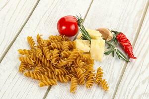 Raw whole grain pasta fusilli photo