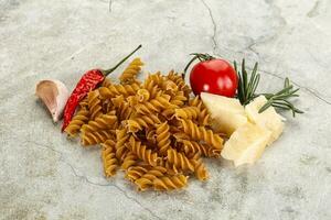 Raw whole grain pasta fusilli photo