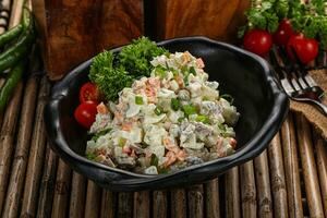 Traditional Russian salad with mayonnaise photo