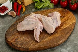 Raw chicken wings foe cooking photo