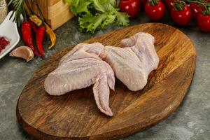 Raw chicken wings foe cooking photo