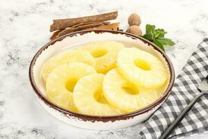 Sweet Canned pineapple in the bowl photo