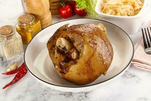 Baked pork knee with spices photo