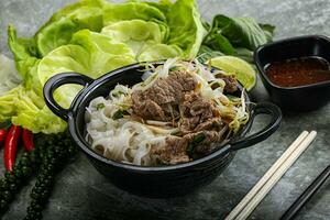 Vietnamese traditional soup Pho Bo with beef photo