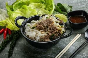 Vietnamese traditional soup Pho Bo with beef photo