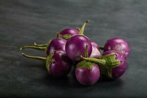 Raw small purple asian baby eggplant photo