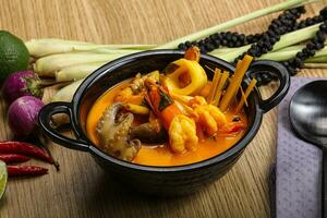 Thai Tom Yum soup with seafood photo