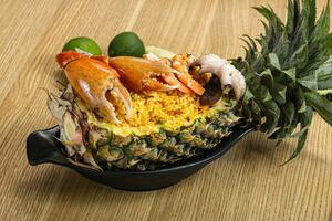 Rice with seafood in pineapple photo