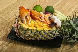 Rice with seafood in pineapple photo