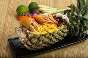 Rice with seafood in pineapple photo