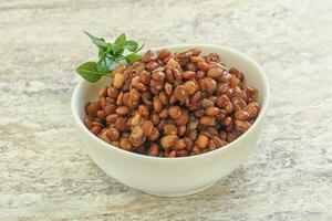 Boiled lentil in the bowl photo