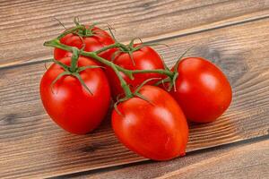 Raw red Flamenco tomato branch photo