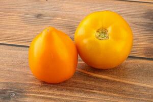 Ripe yellow bright juicy tomato photo