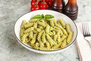 Italian pasta with basil pesto photo