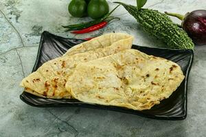 Indian tandori bread - naan with cheese photo