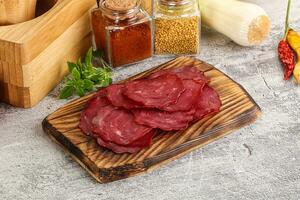 Smoked beef meat - Pastrami slices photo