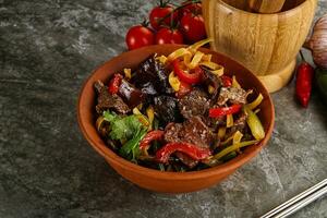 Asian wok with noodle, vegetables and beef photo