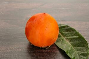 Fresh ripe sweet juicy persimmon photo