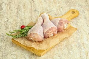 Raw chicken leg Drumstick for cooking photo