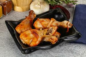 Raw marinated chicken drumstick for cooking photo